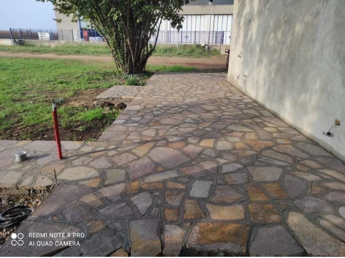 M&L Exterior Design — Hand-cut natural flagstone walkway in crazy-paving pattern