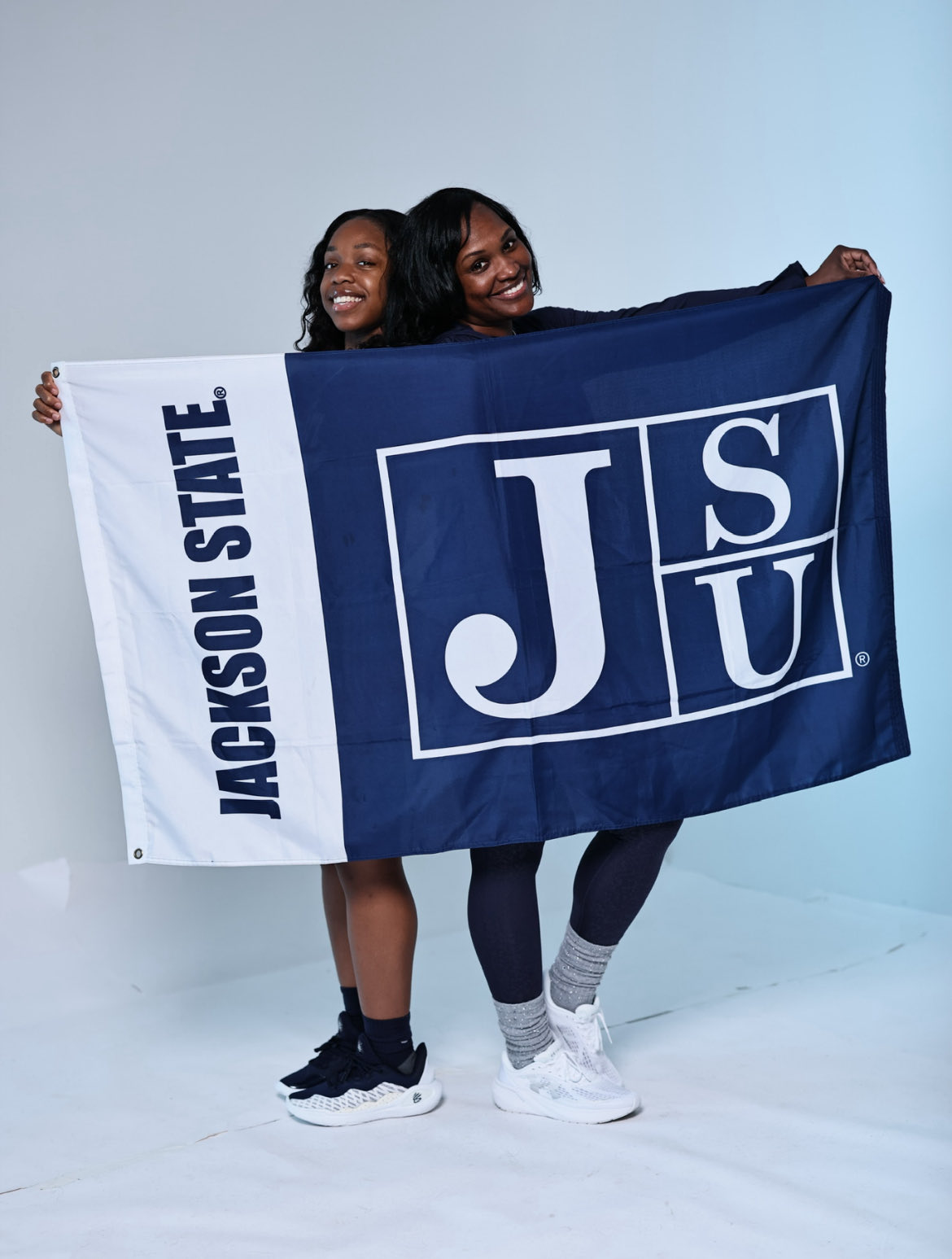 Cassidy Gladney and Keshuna Luckett with JSU Flag