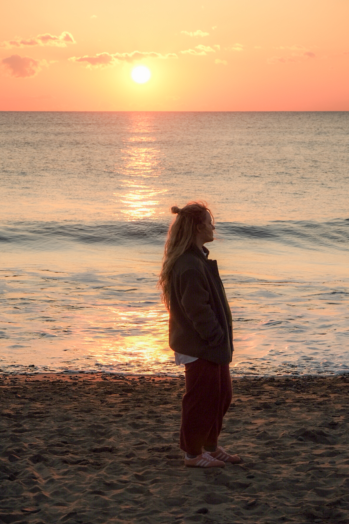 Jax watching sunset on Cornwall beach