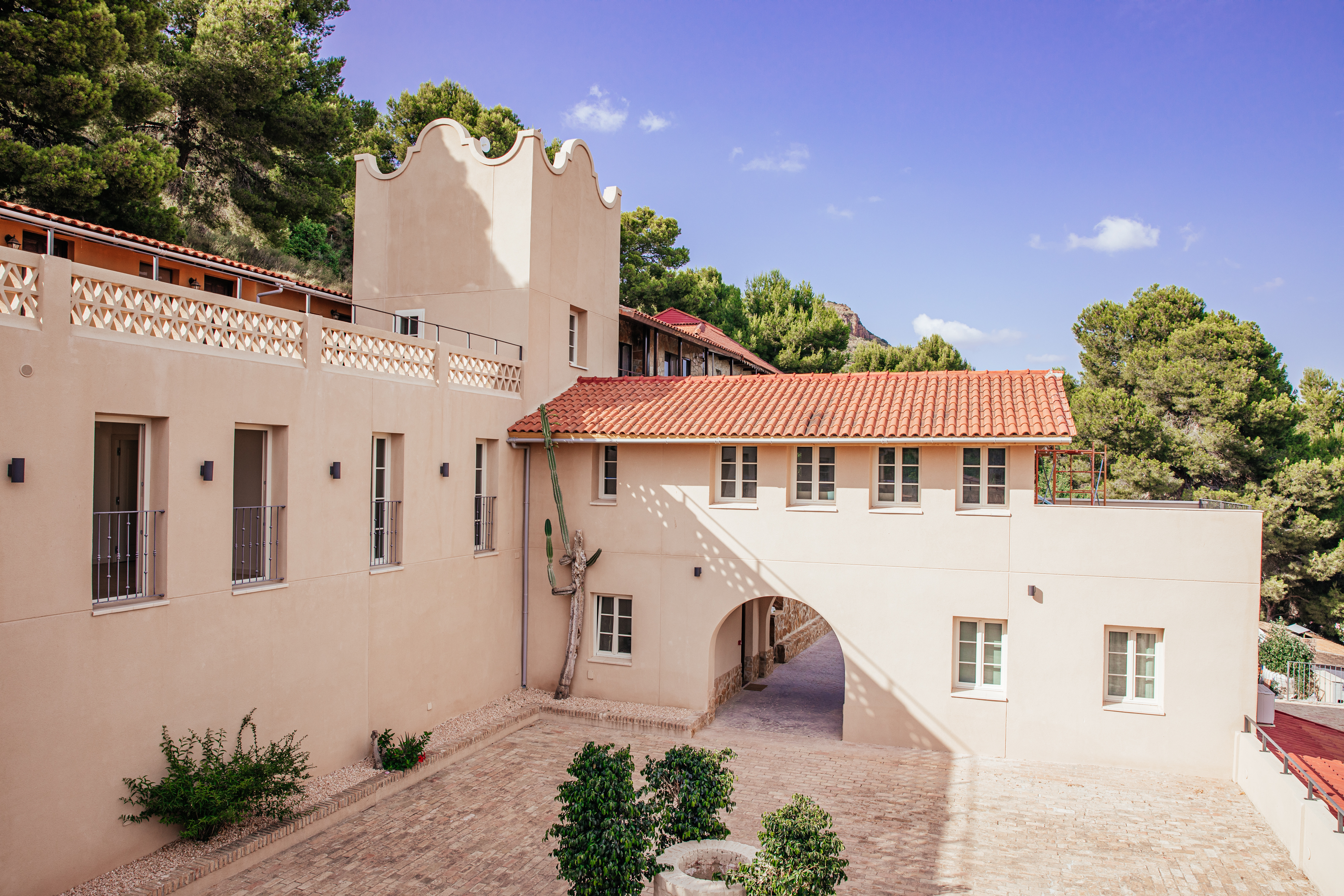 Villa courtyard and arched entry by daylight