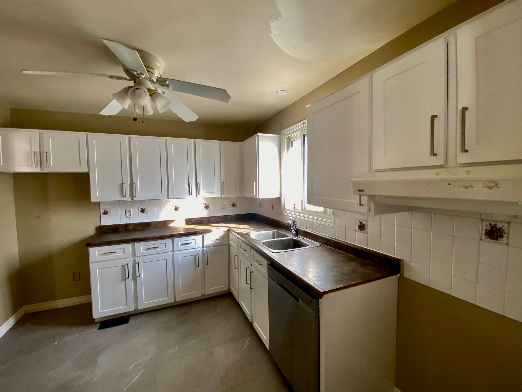 After refinish — Honey oak → white shaker, brushed nickel pulls