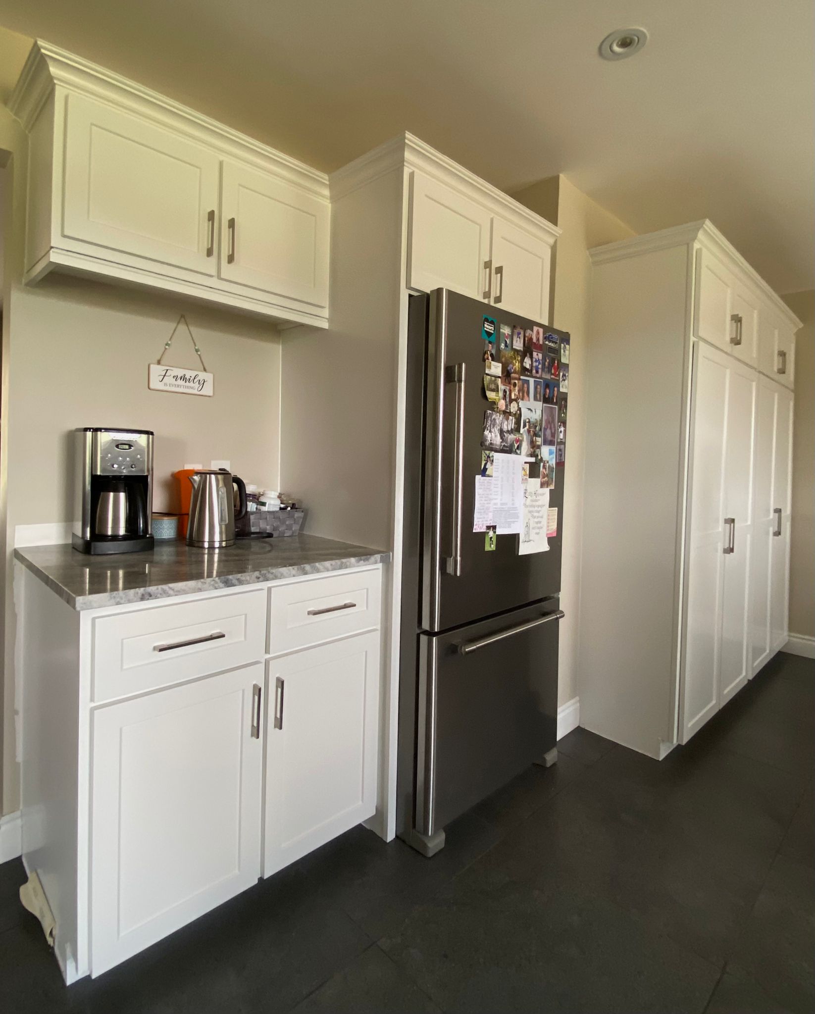 After refinish — Cathedral oak → white shaker (mid-reno)
