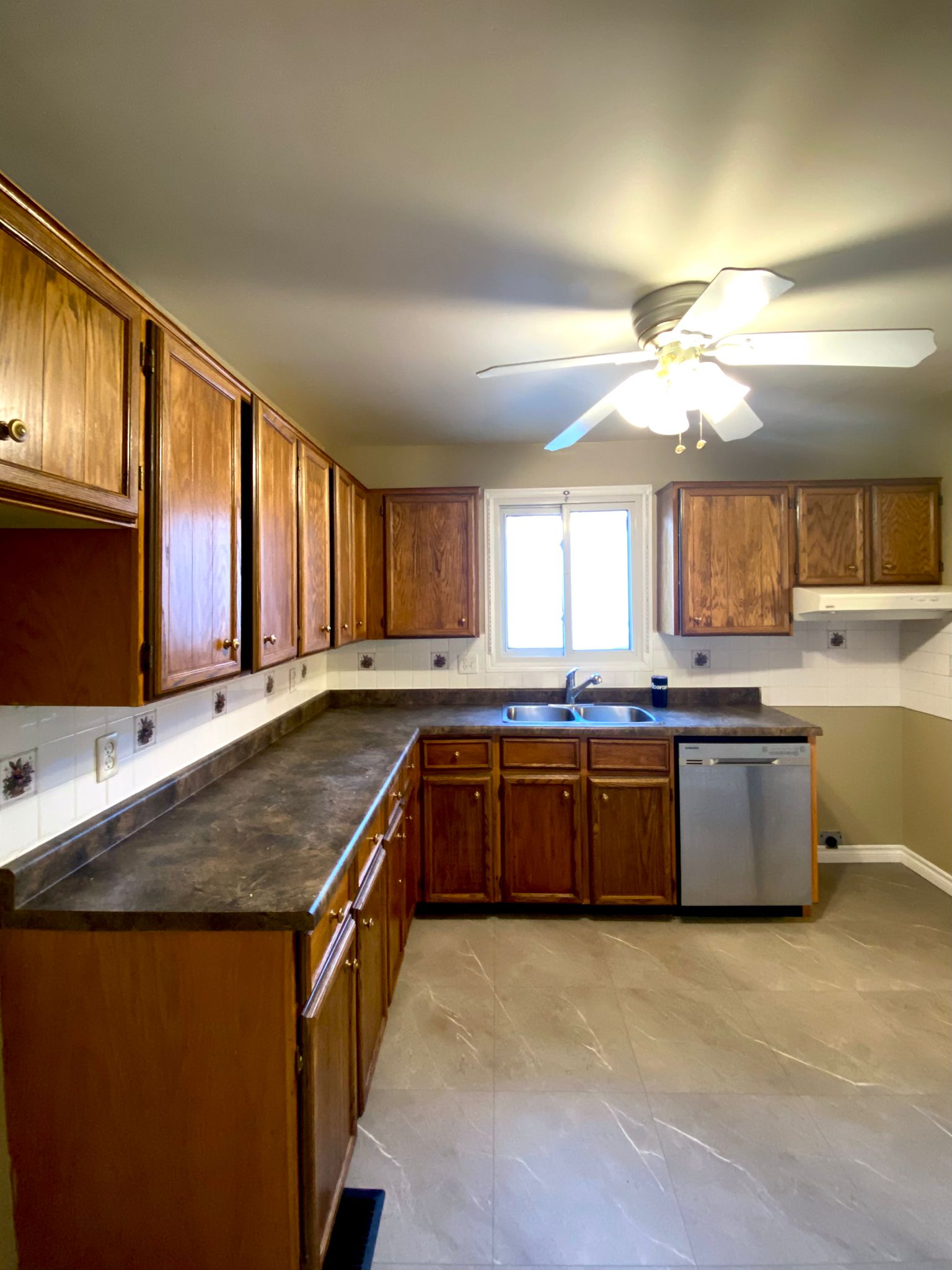 Before refinish — Honey oak → white shaker, brushed nickel pulls