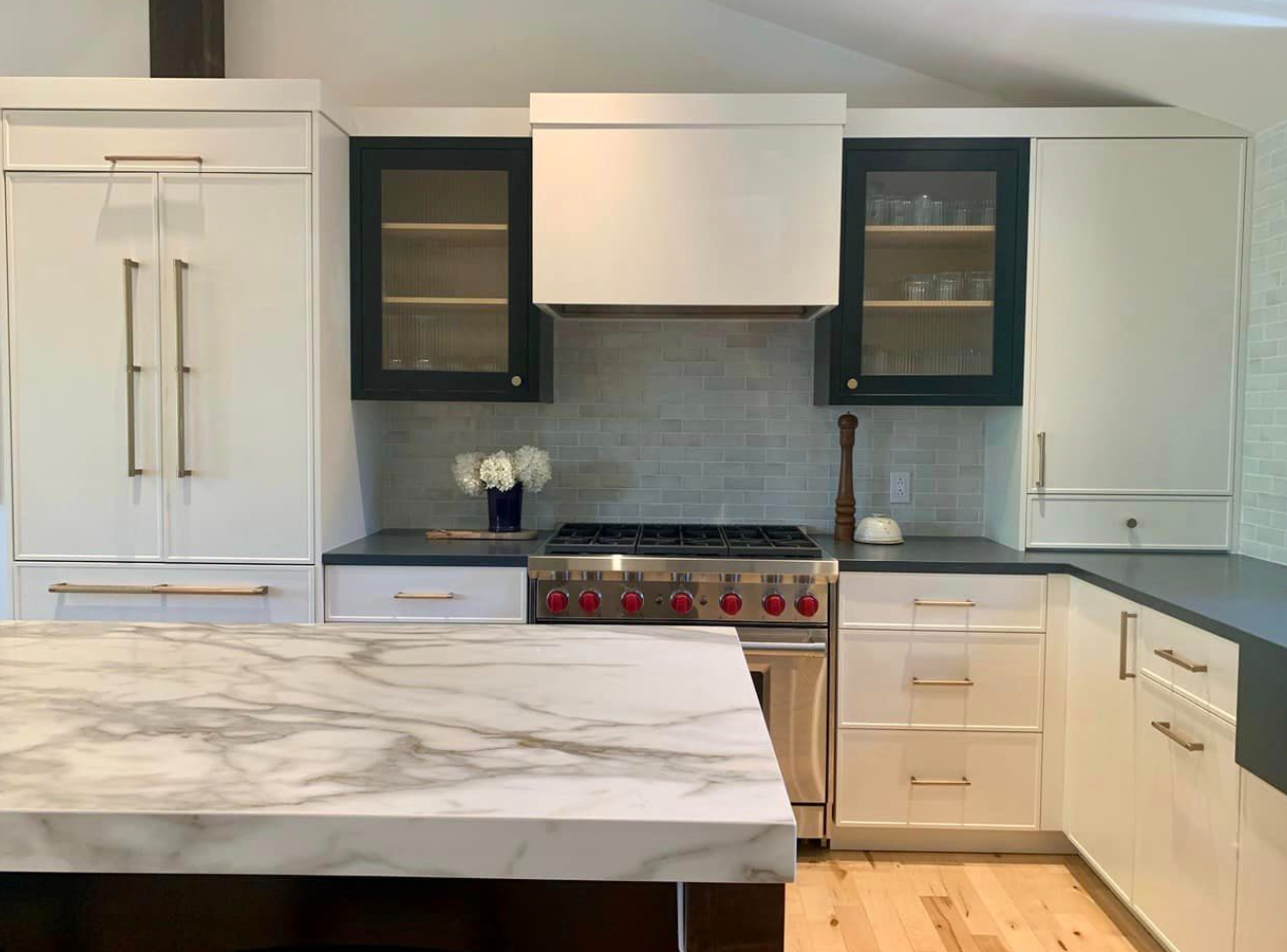 Belmont Custom Cabinetry โ white kitchen with two-tone cabinets and marble island