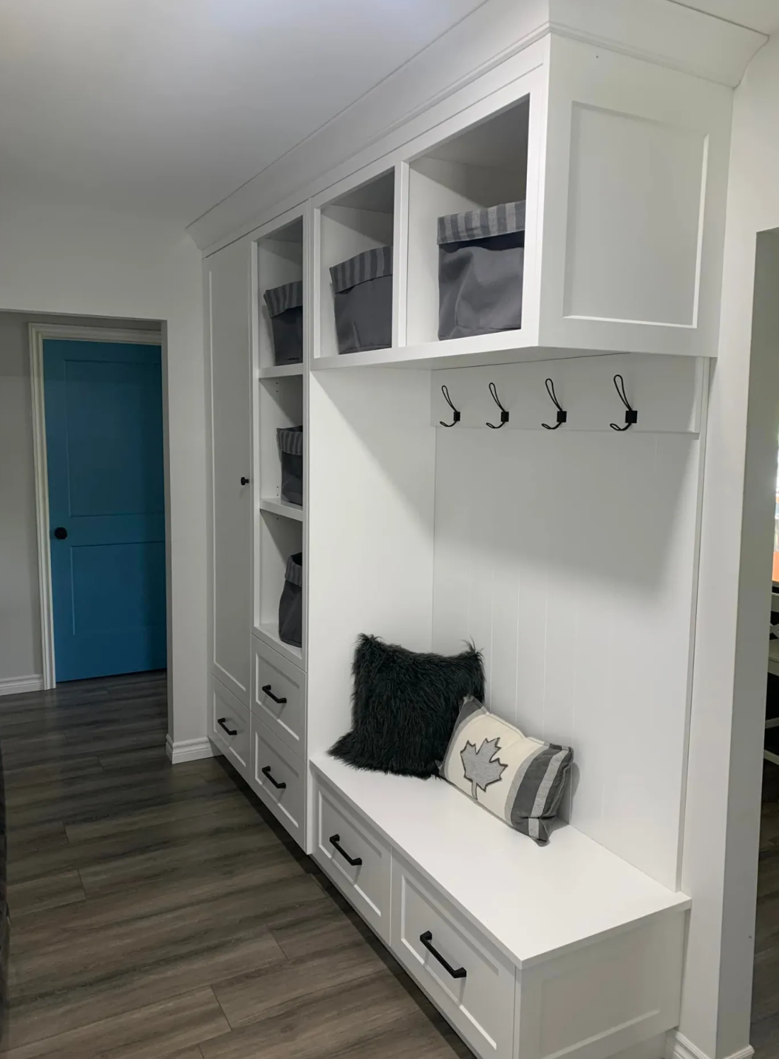 Belmont Custom Cabinetry โ white mudroom built-in with bench seating