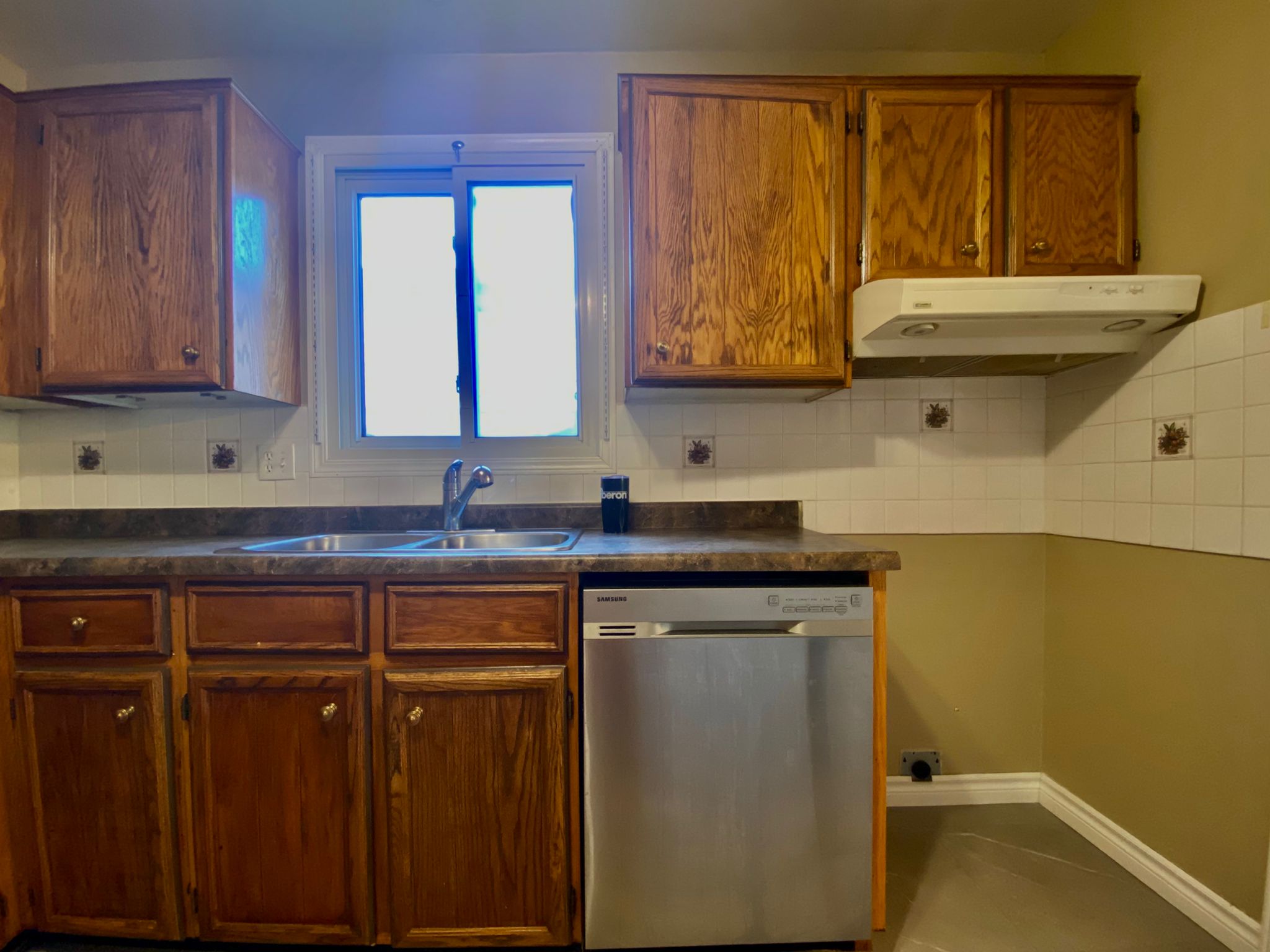 Before refinish — Honey oak → white shaker, brushed nickel pulls
