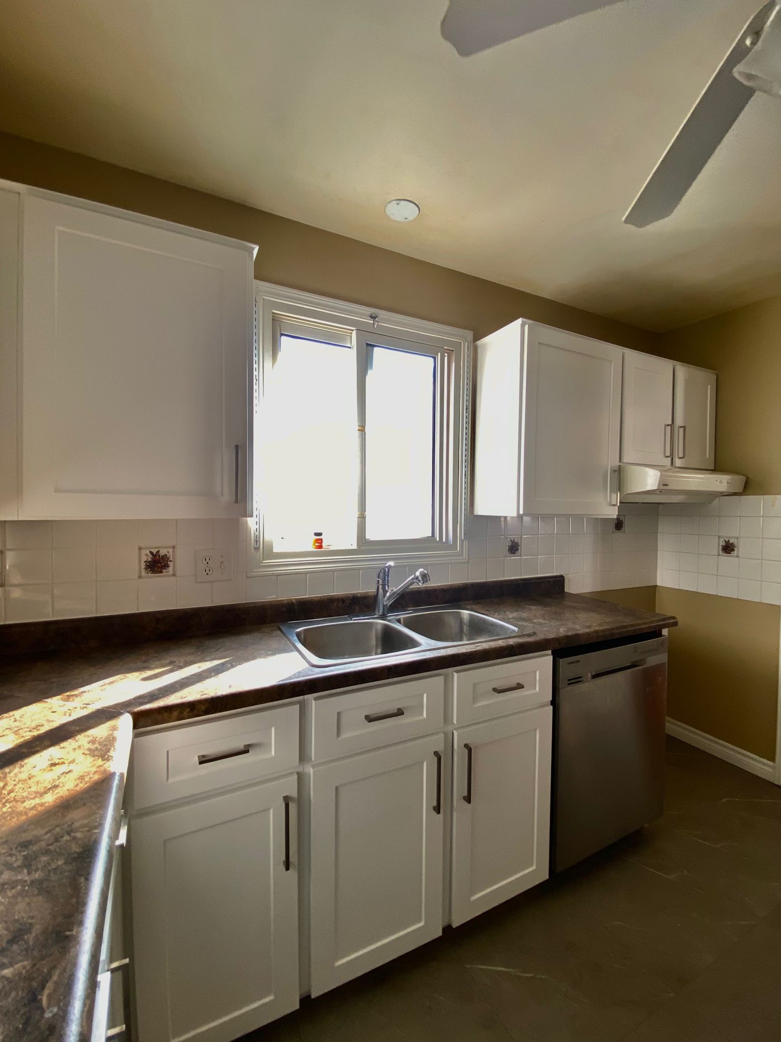 After refinish — Honey oak → white shaker, brushed nickel pulls