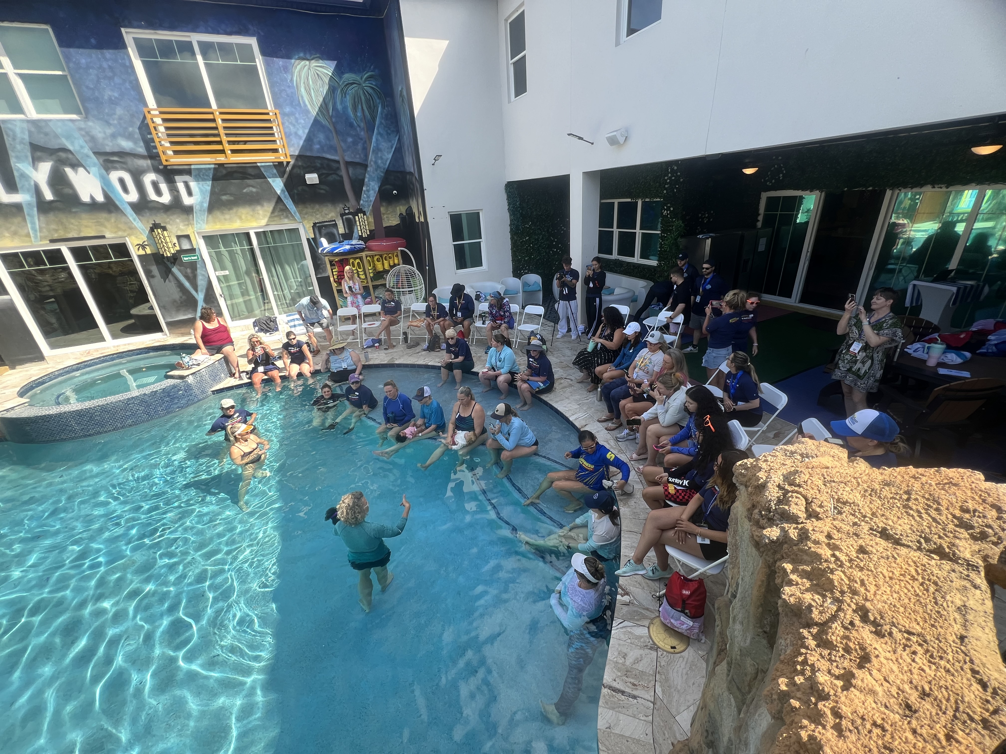 Overhead view of a poolside retreat session