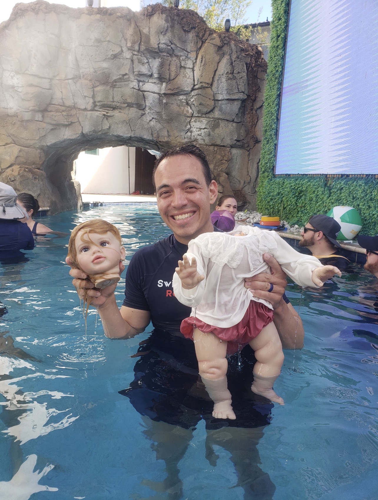 Practice doll demonstration in the pool