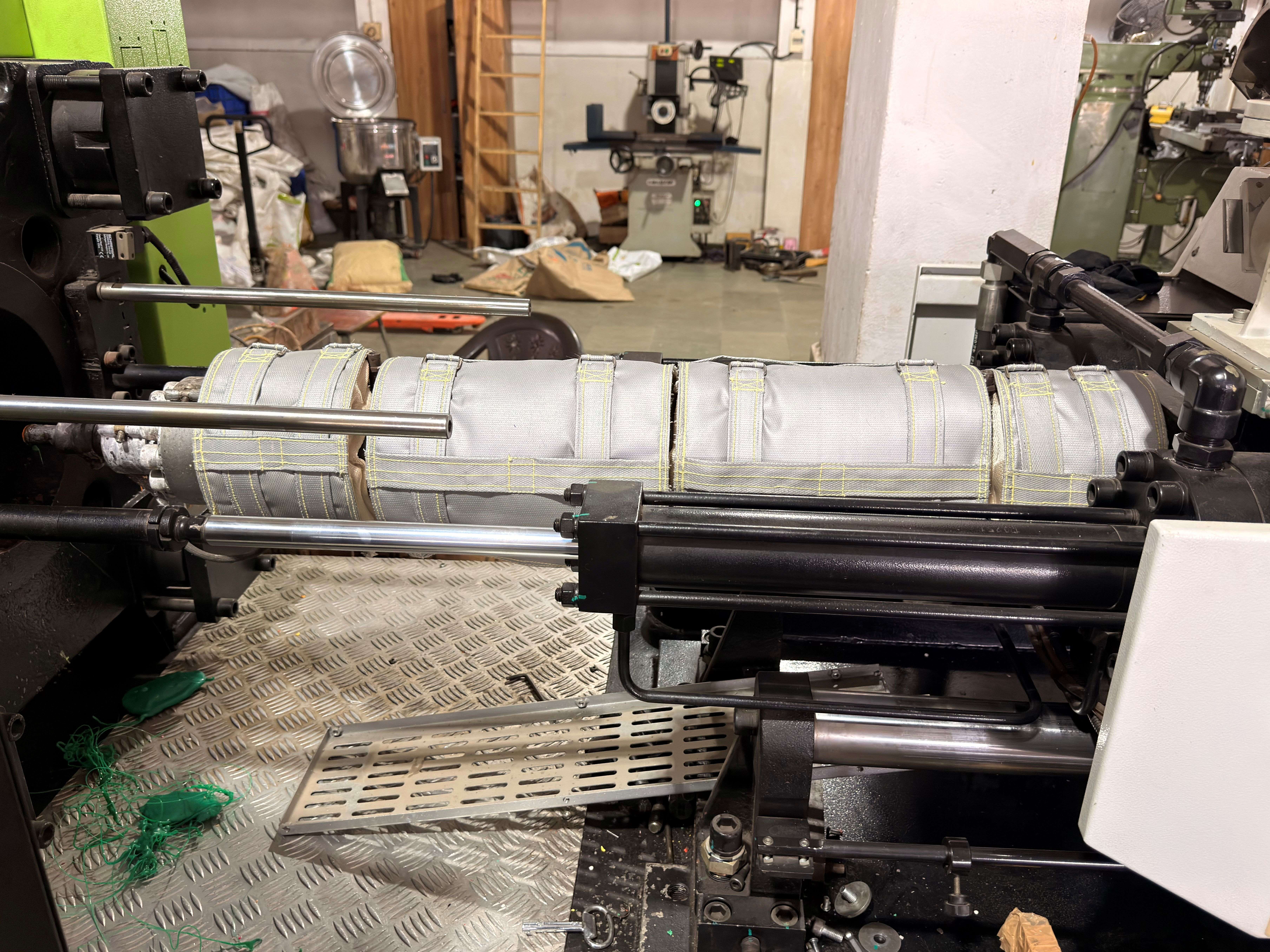 i-Wrap insulation jacket installed on injection molding machine barrel inside customer plant on the production floor