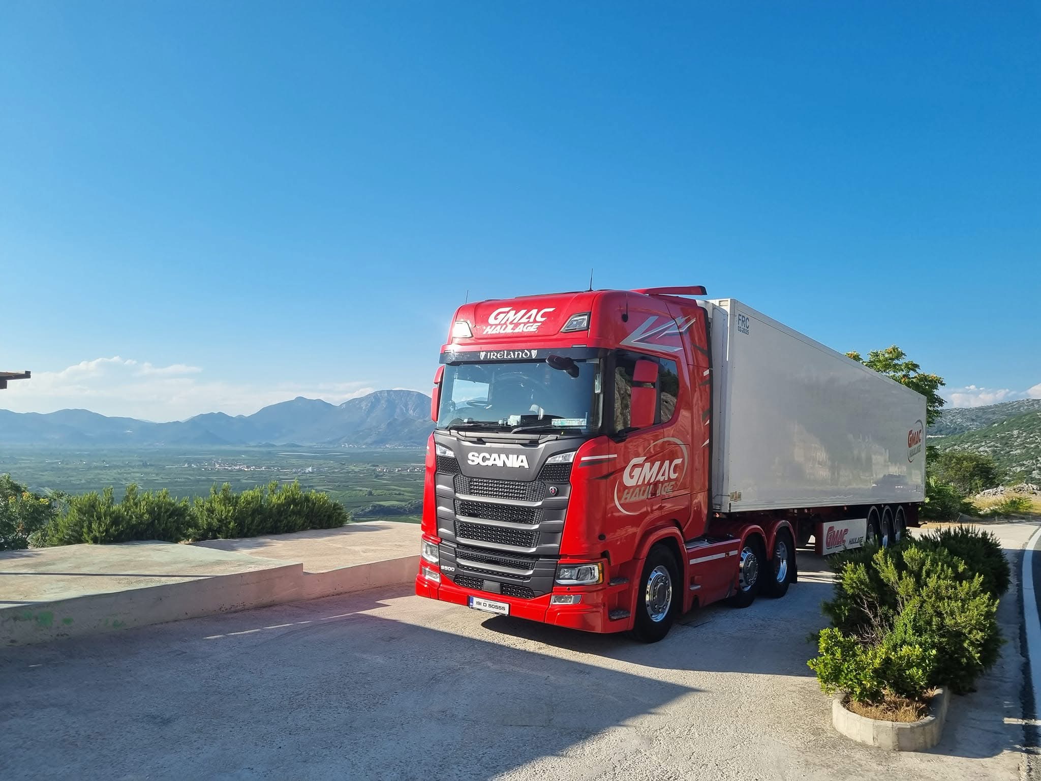 GMAC Haulage red Scania S500 on the road to Montenegro overlooking a mountain valley