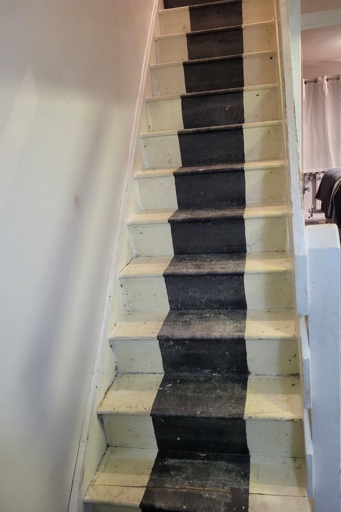 Old worn stair carpet before replacement