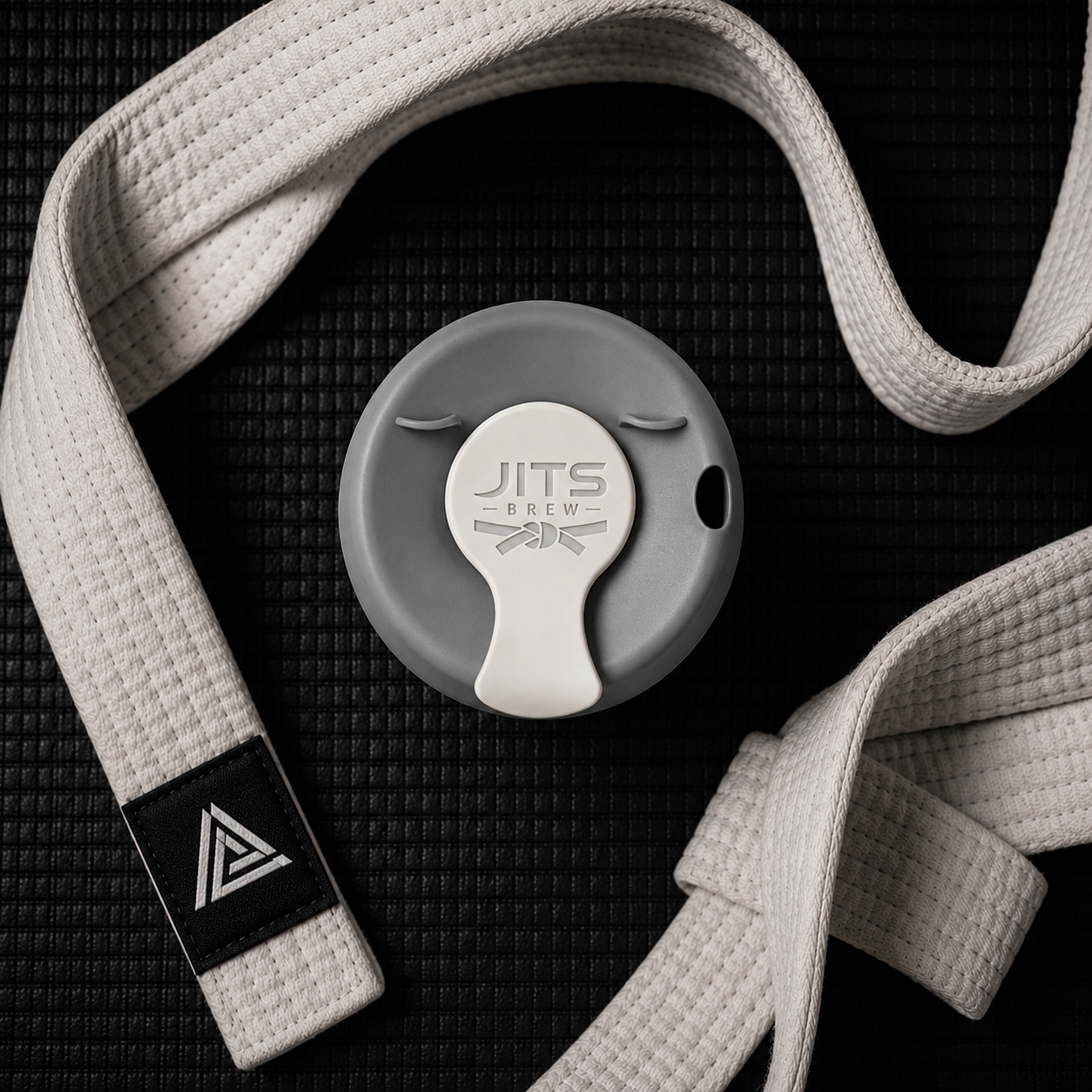 Grey lid with white belt — top down