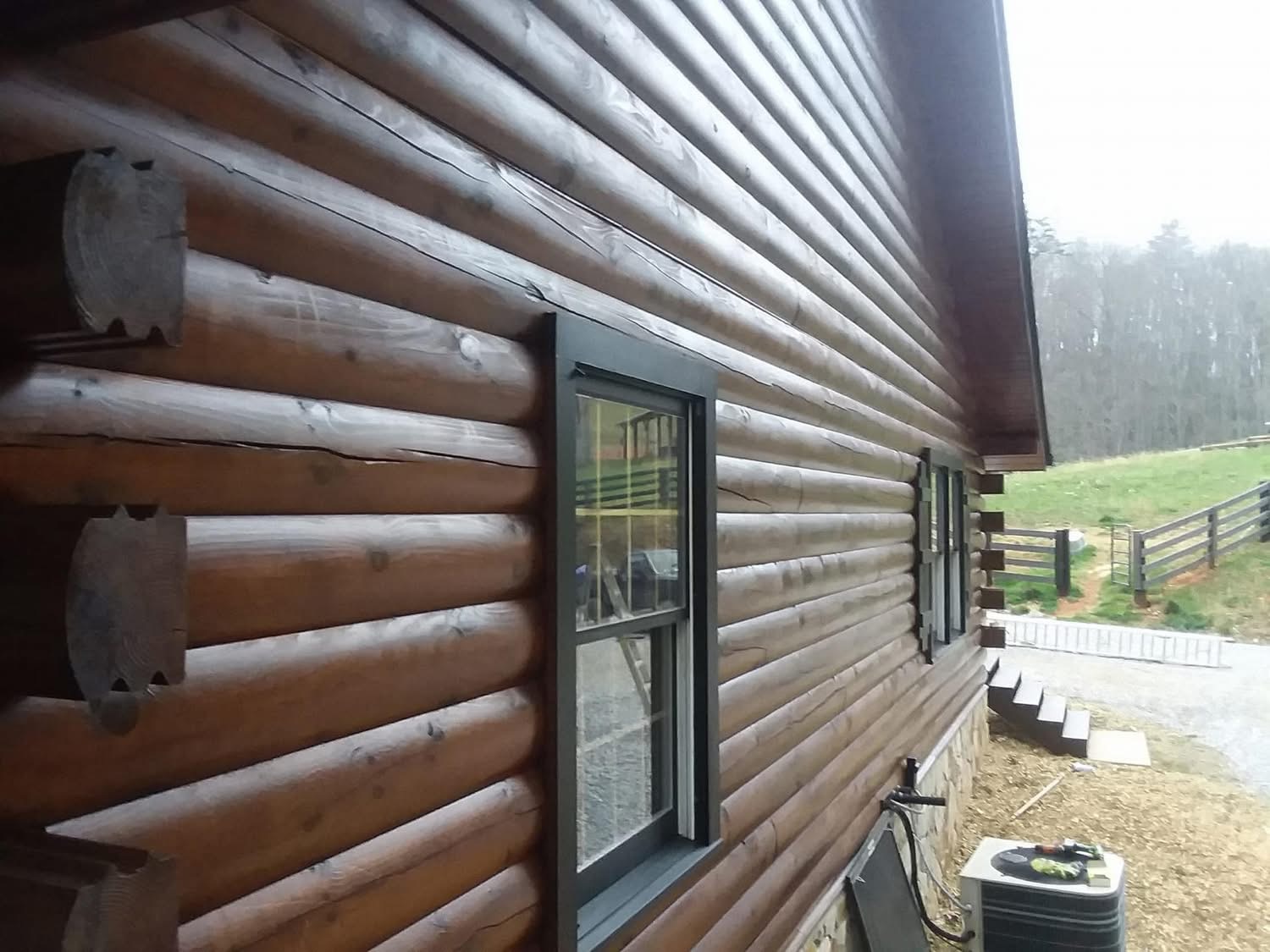 Journey's Handyman project — Rich, even stain across full log siding