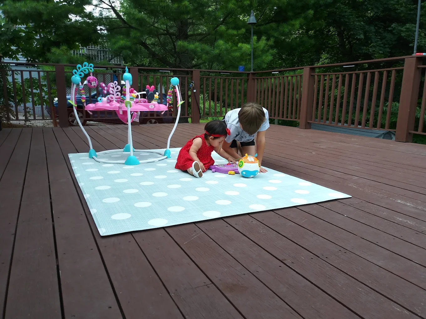 Children playing outside on the deck
