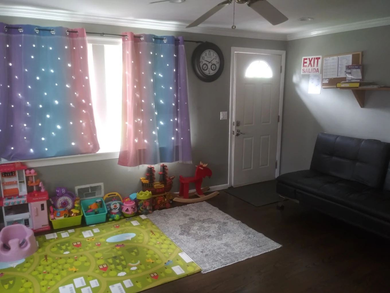 Bright entryway with starry curtains, toys and cozy futon