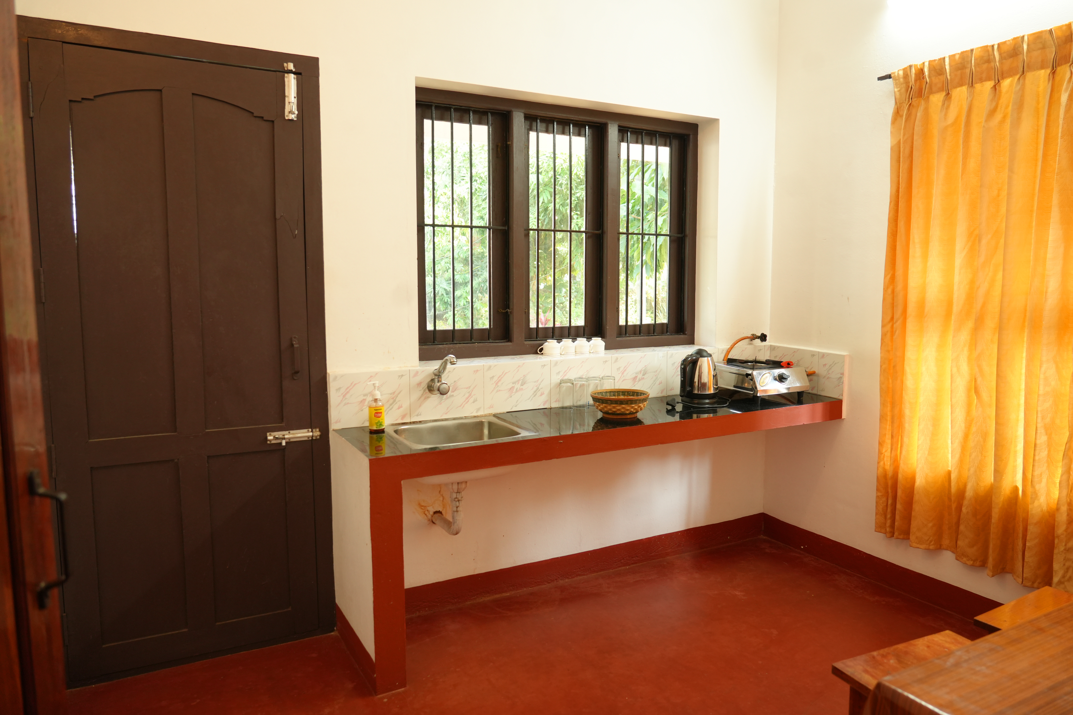 A small kitchen at Kakkanat Ayurvedic postnatal care villas, Kerala