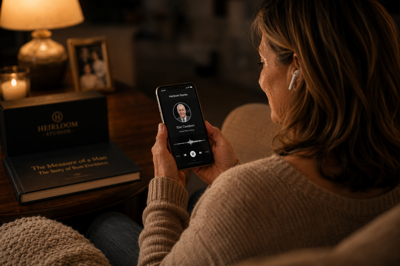 A woman listening to her father's voice recording