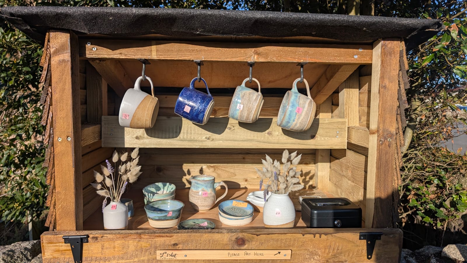 L'Islet Pottery stall with handmade mugs and ceramics