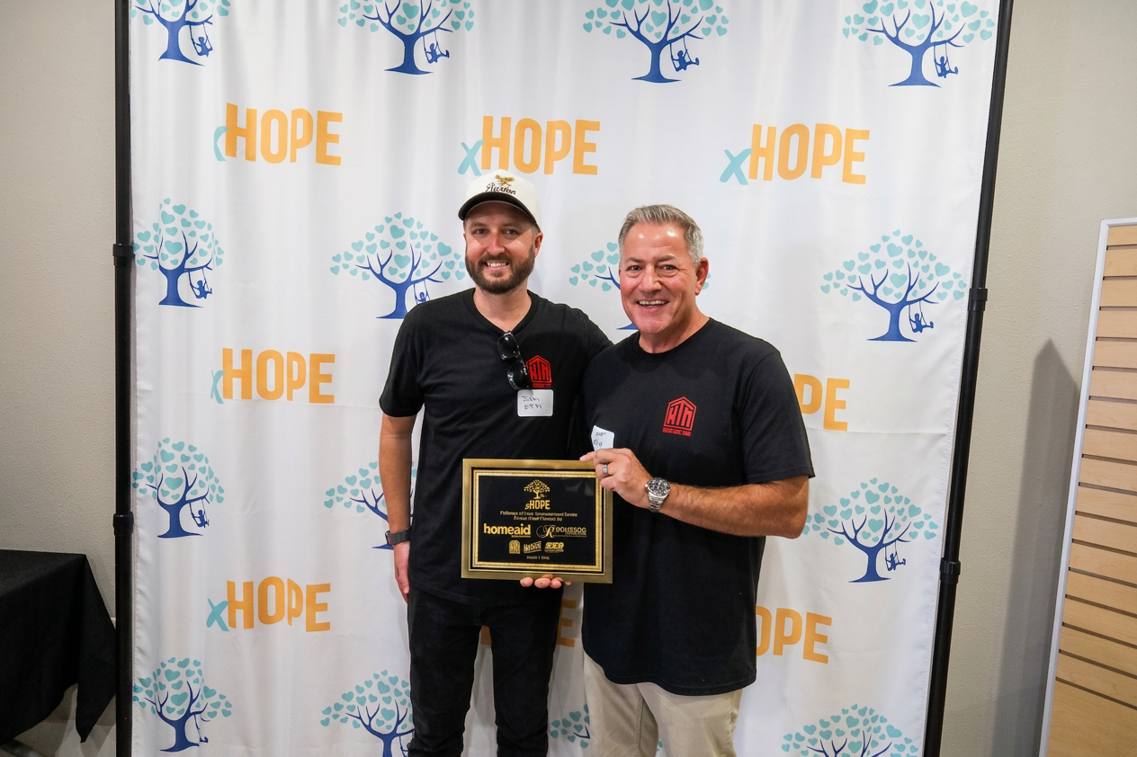 KTM team receiving X Hope recognition plaque
