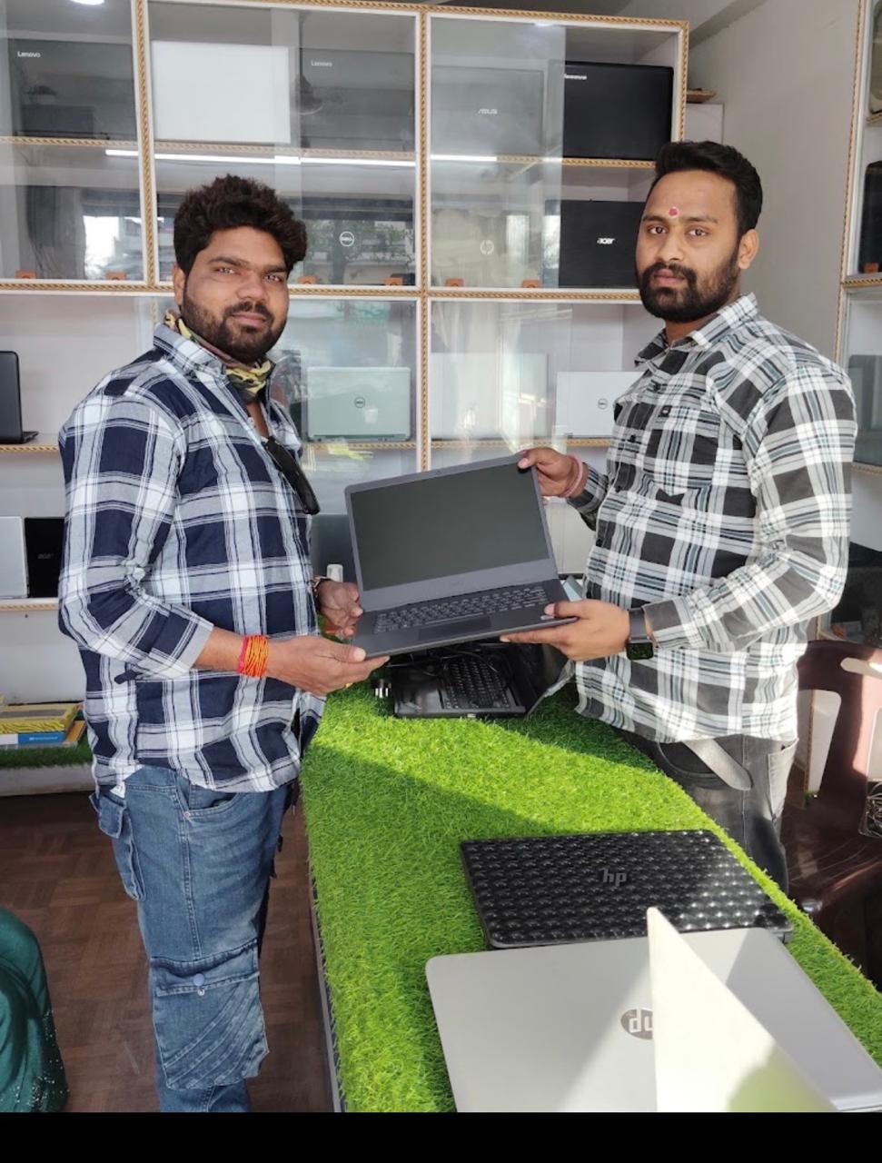 Handing over a brand-new laptop — customer walked out with a fresh setup, ready to boot up.
