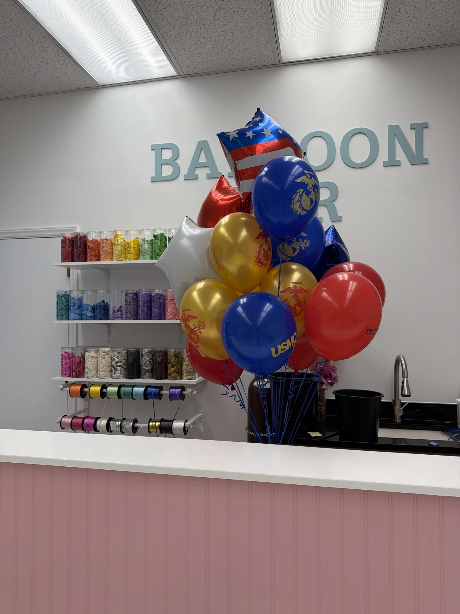 Custom USMC-themed balloon bouquet at the Balloon Bar
