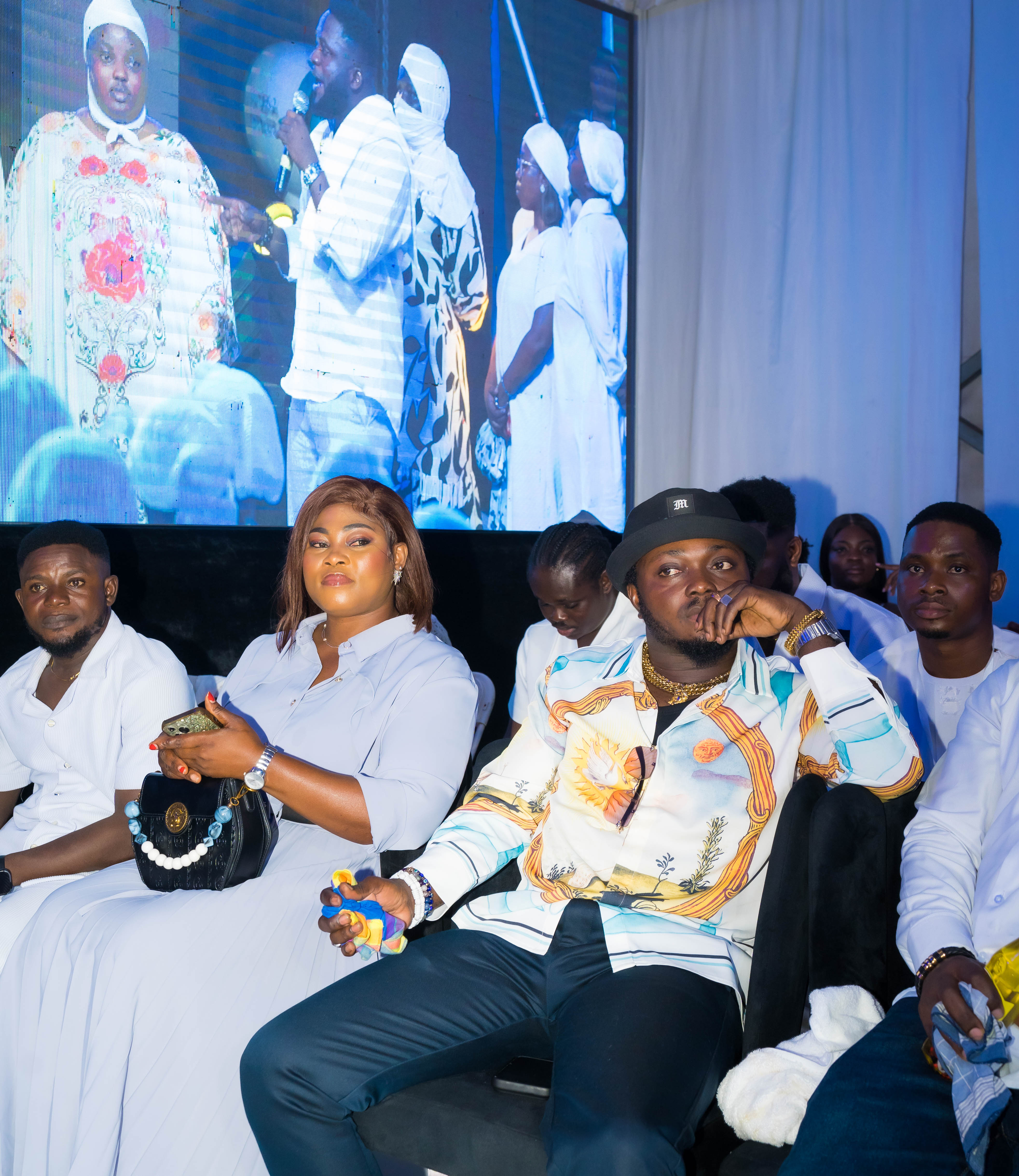Pastor White ministering on stage alongside a fellow pastor during a White Outreach Movement prayer gathering