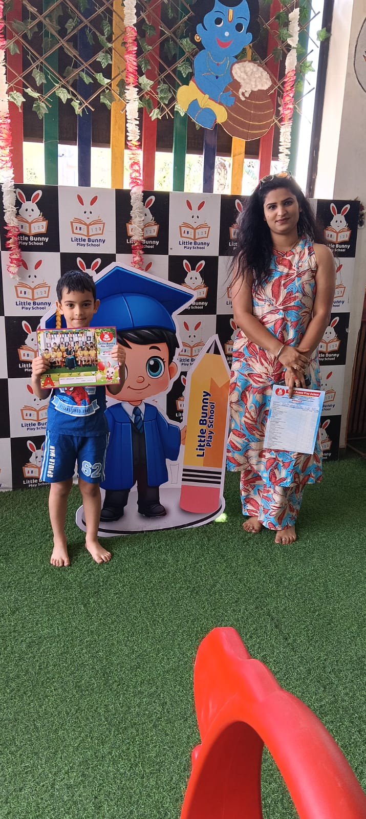 Student receiving certificate with teacher