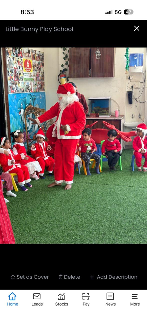 Santa Claus with children in Santa costumes