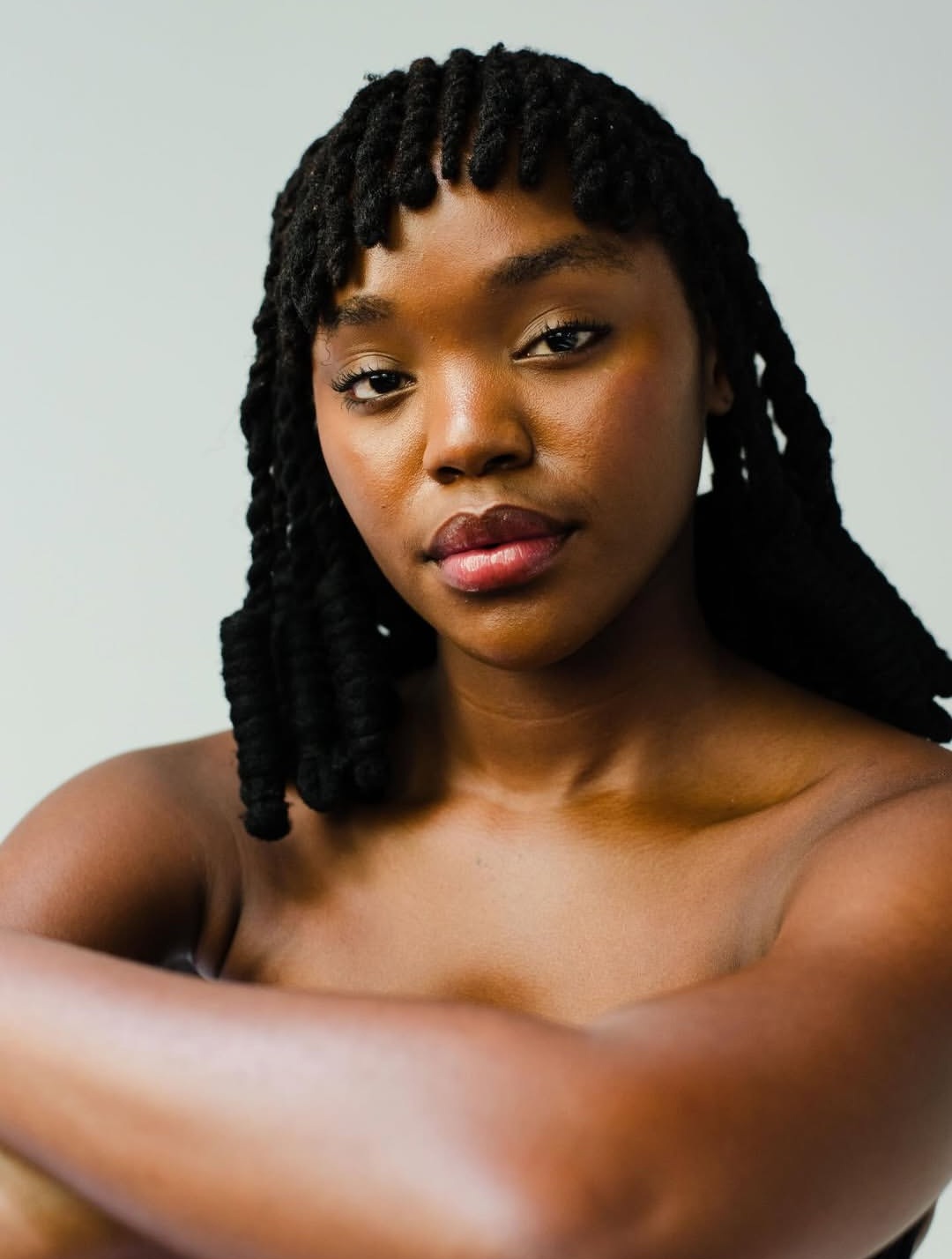 Natural barrel curl locs portrait