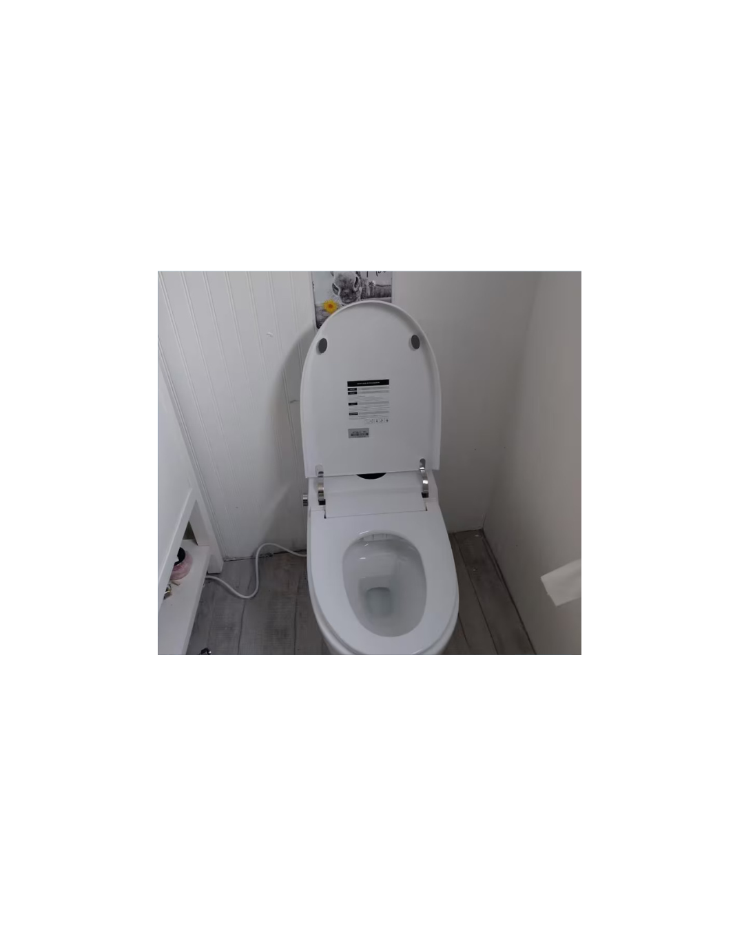 FlowLux smart toilet — Gucci-tile bathroom