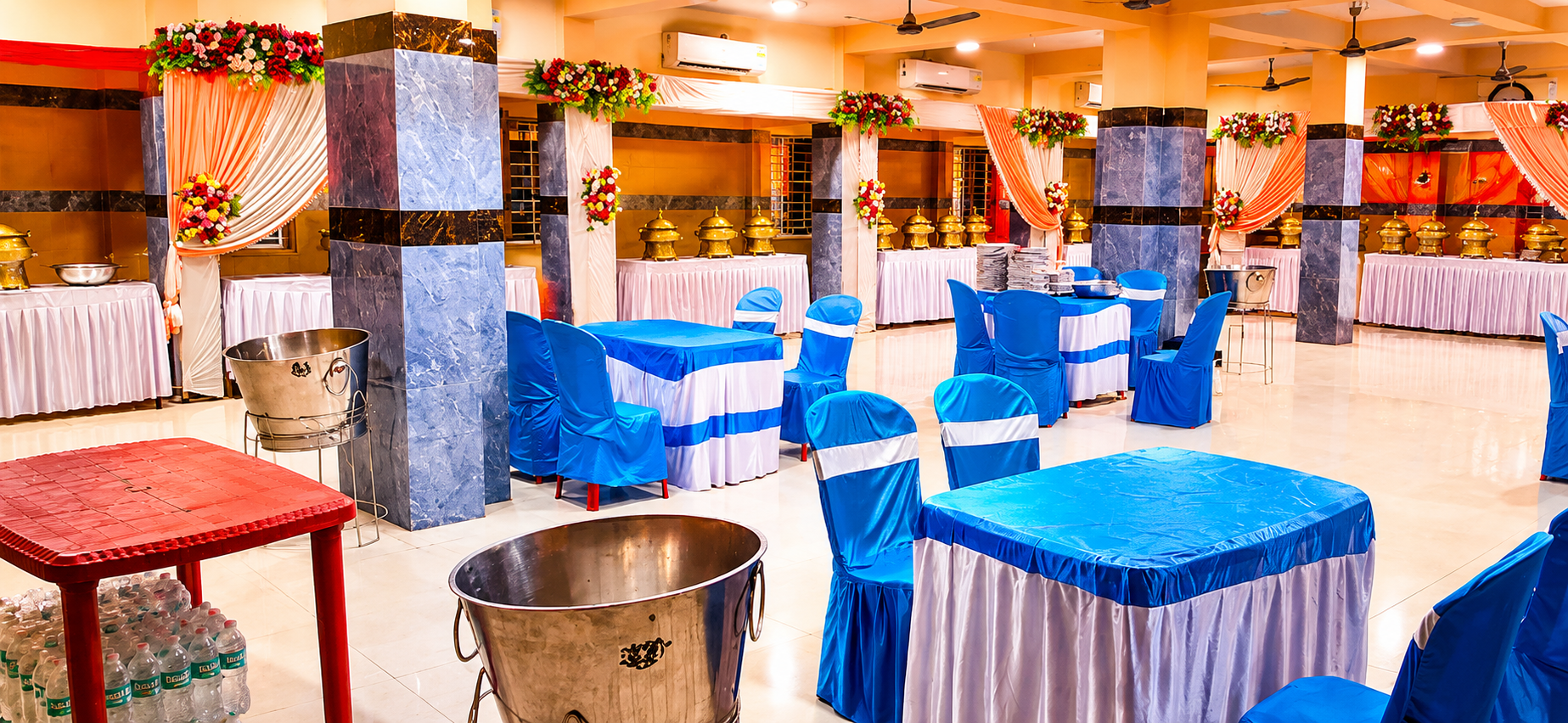 Royal blue & white banquet setup with gold chafing dishes