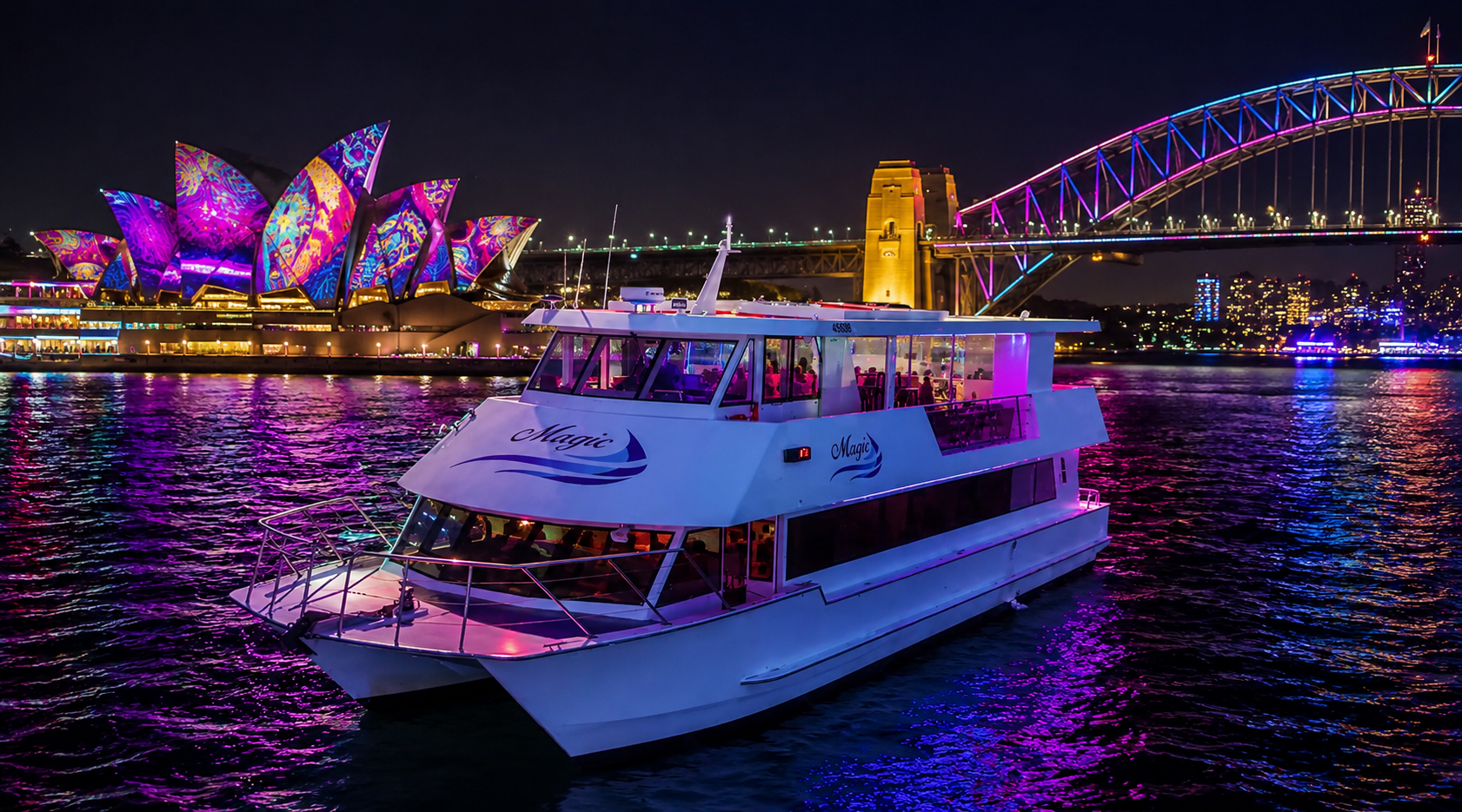 Vivid Cruises Sydney, Vivid Cruise Sydney Harbour Vivid Cruises Sydney Harbour cruise sailing past the Sydney Opera House and Harbour Bridge lit with colourful Vivid Sydney festival lights at night