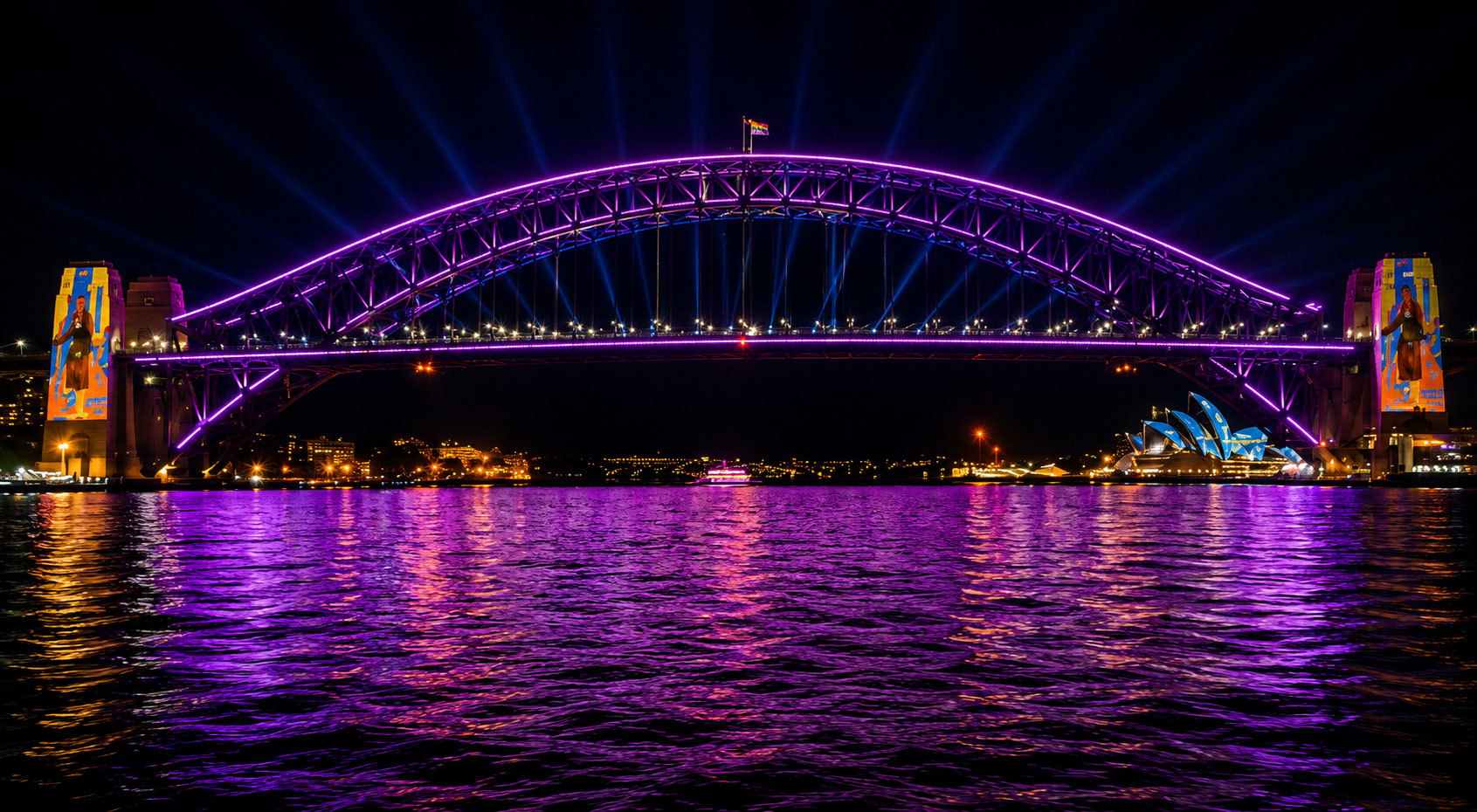 Sydney Harbour Bridge lit in deep purple neon outlines during Vivid Sydney · Opera House in background · cruise view