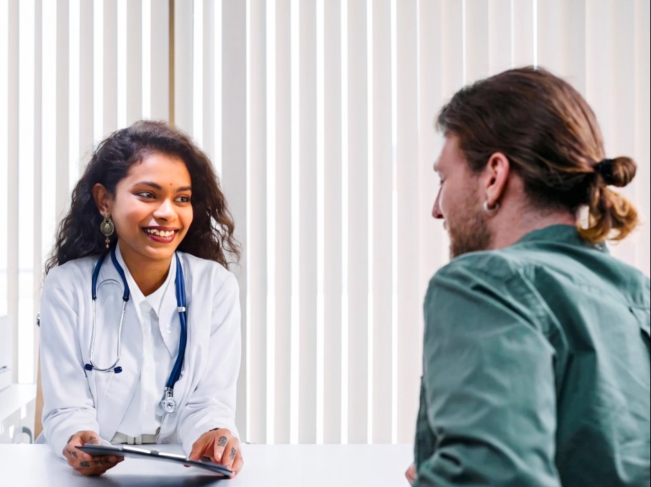 Medical specialists discussing patient care at a modern Indian hospital — AmanSehat