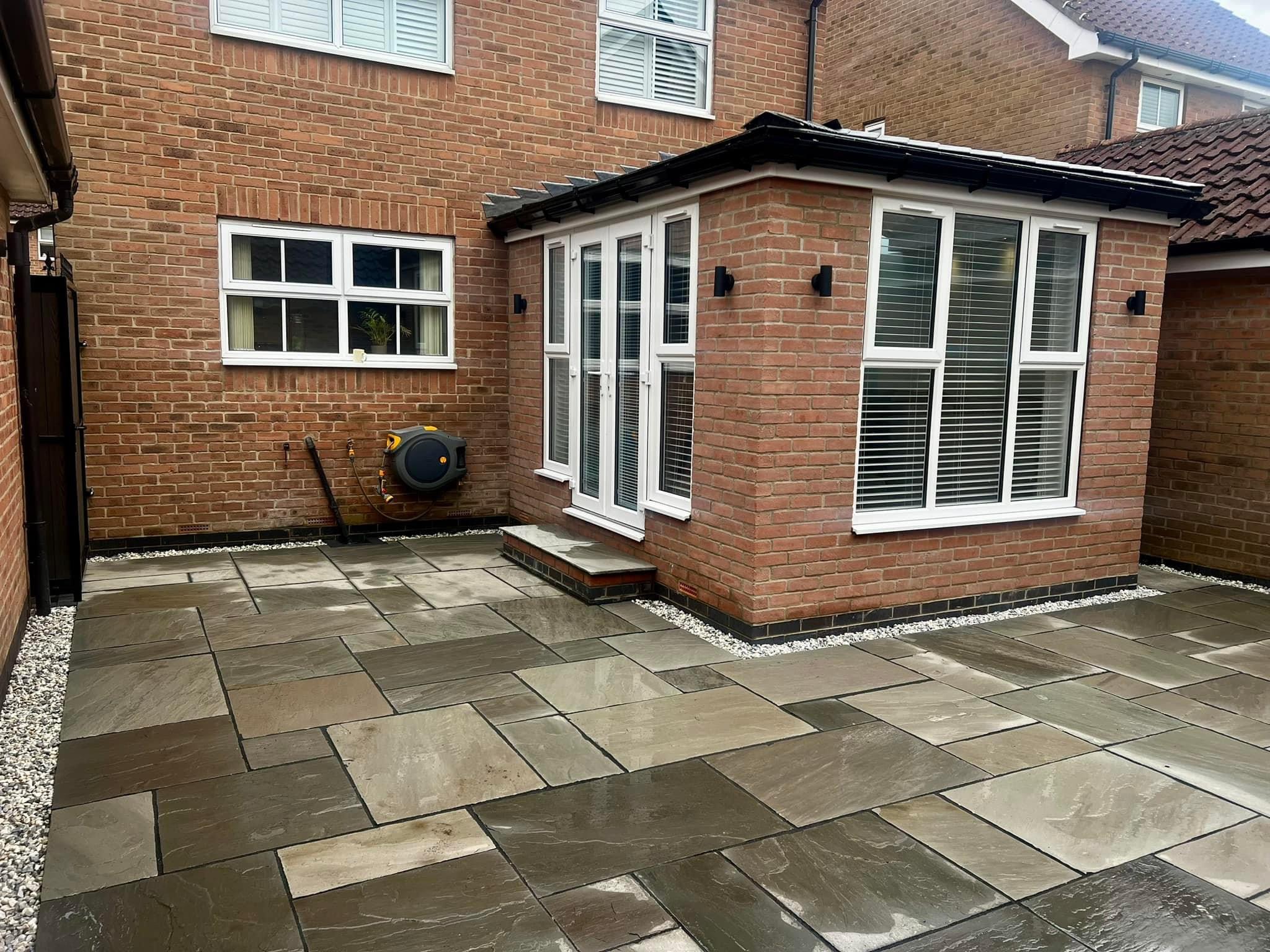 Brick Extension with French Doors and Stone Patio