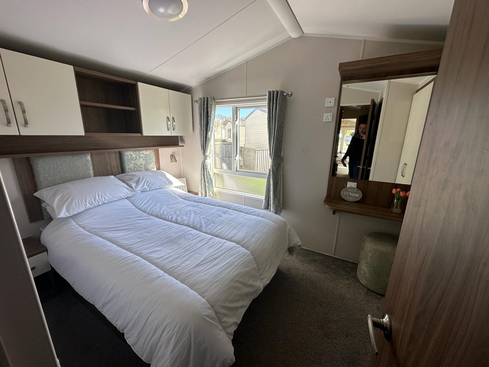 Master bedroom with double bed in our Hoburne Park holiday caravan