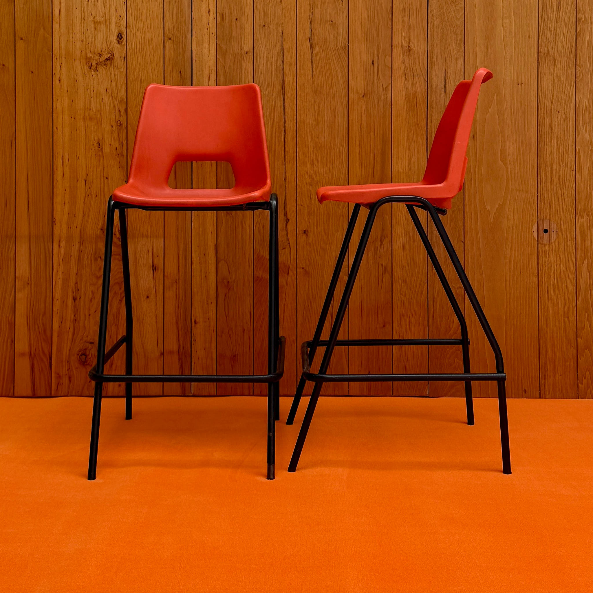 Pair of orange velvet bar stools — available on-site at Peanut Factory Studio