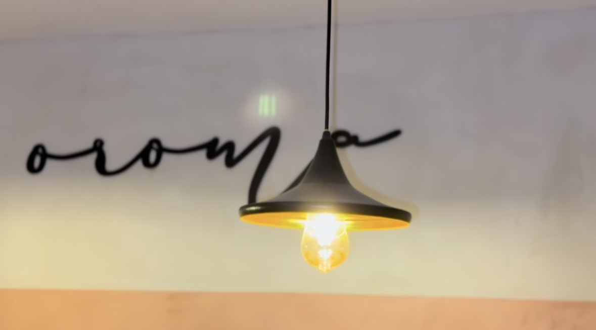 Pendant lamp with oroma wall script