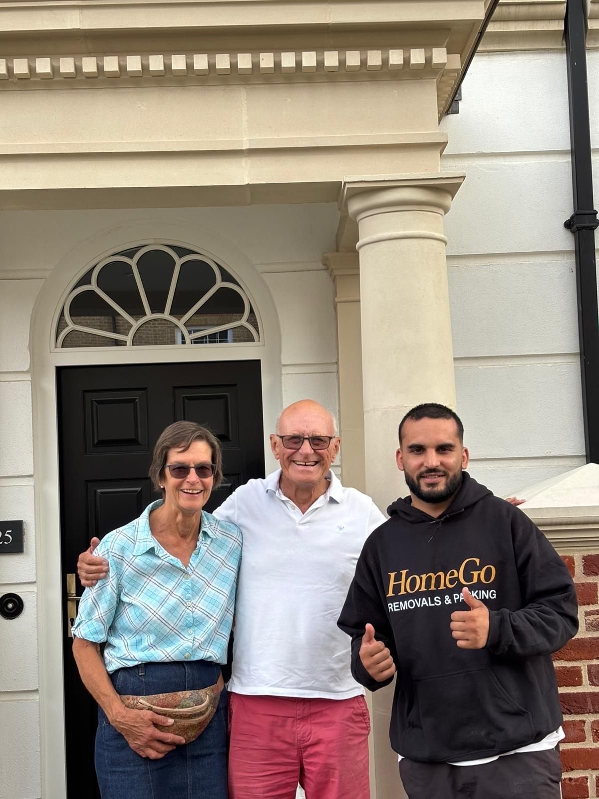 Happy customers with HomeGo Removals mover after a Milton Keynes long-distance move