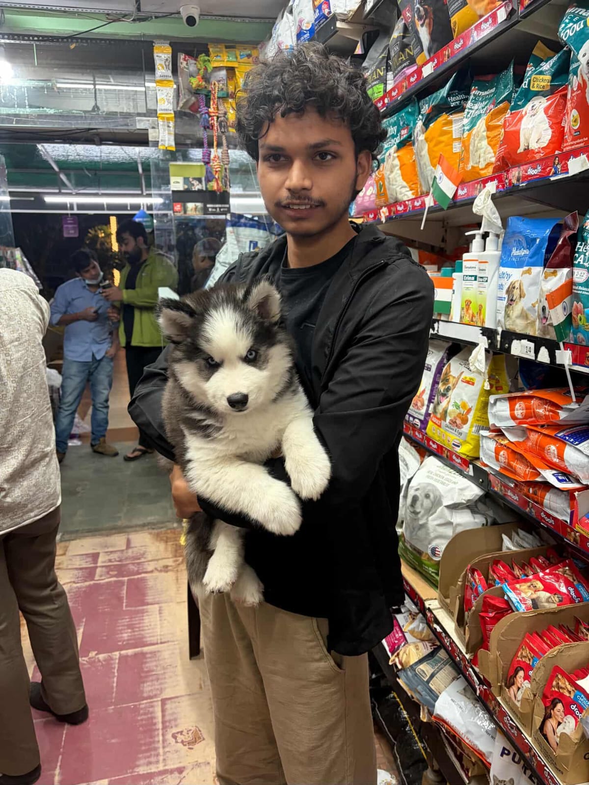 Happy customer with golden retriever puppy