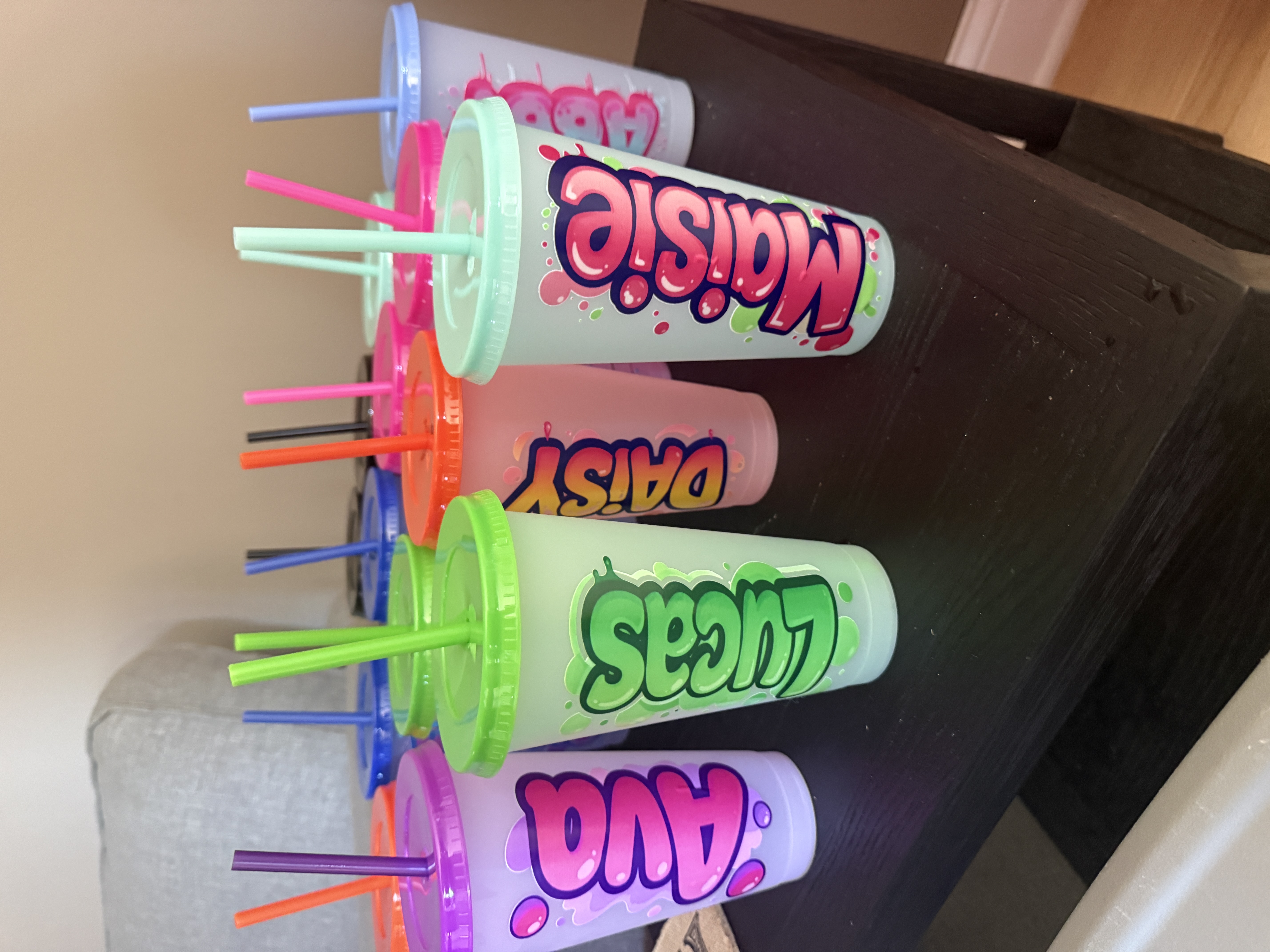 Tall slim personalized tumblers lined up for a tumbler party