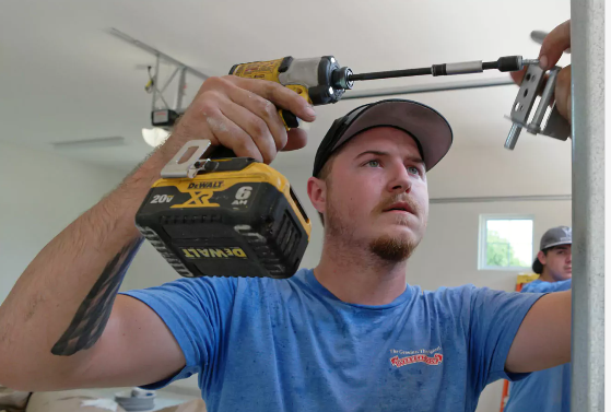 Iron Clad technician installing a garage door