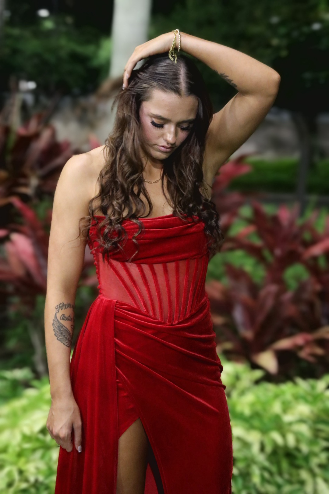 Red gown in tropical garden