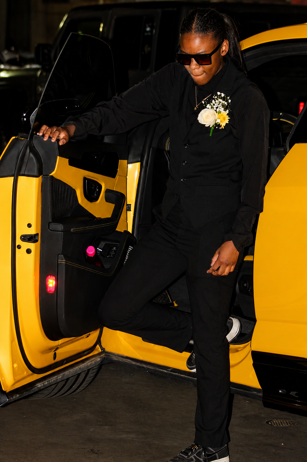 Prom arrival · all-black suit + shades stepping out of yellow Lamborghini
