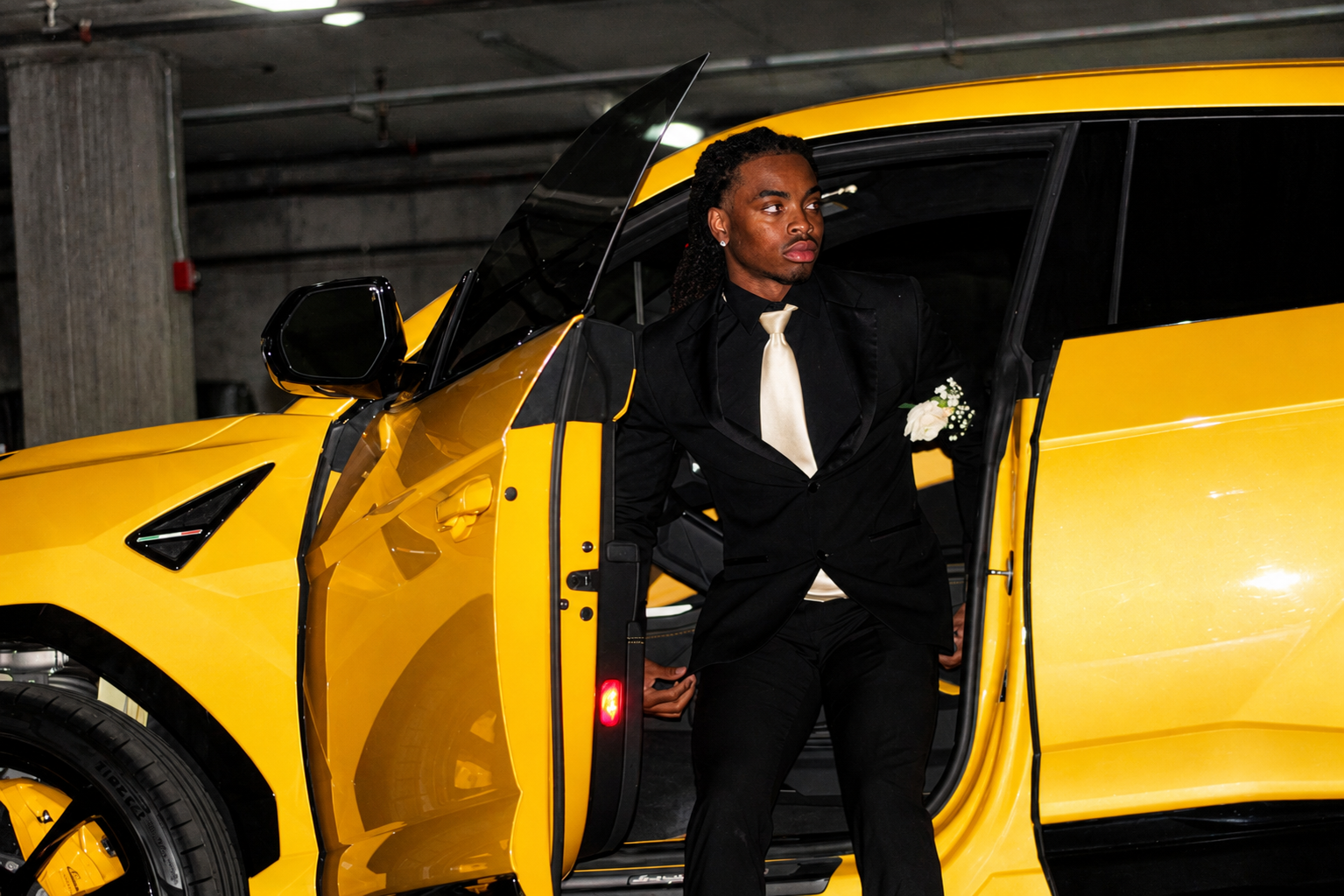 Prom arrival · black tuxedo with ivory tie · yellow Lamborghini