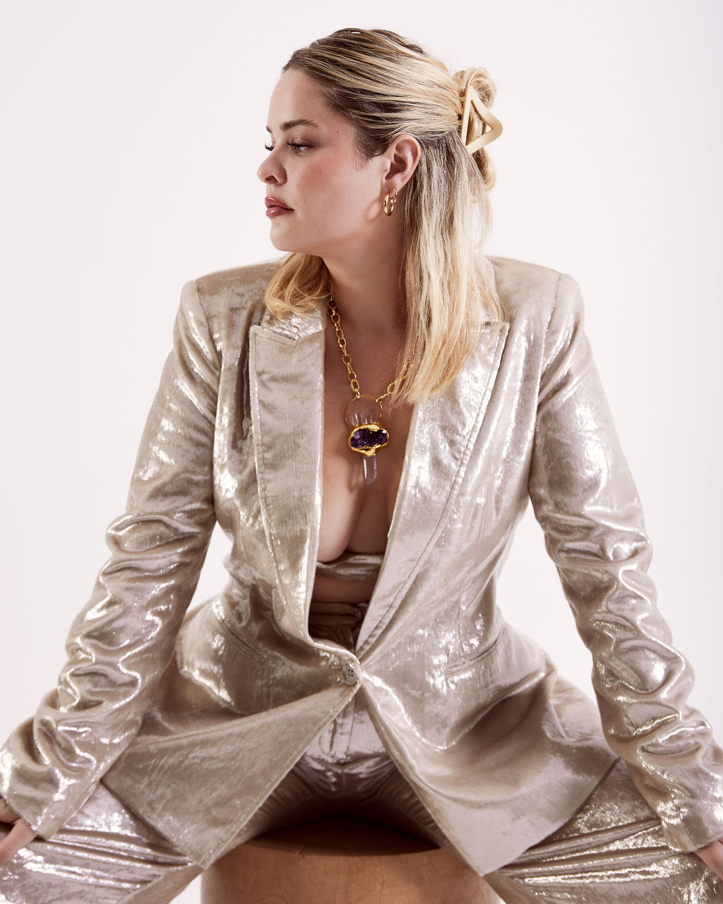 Editorial — metallic suiting with statement jewelry