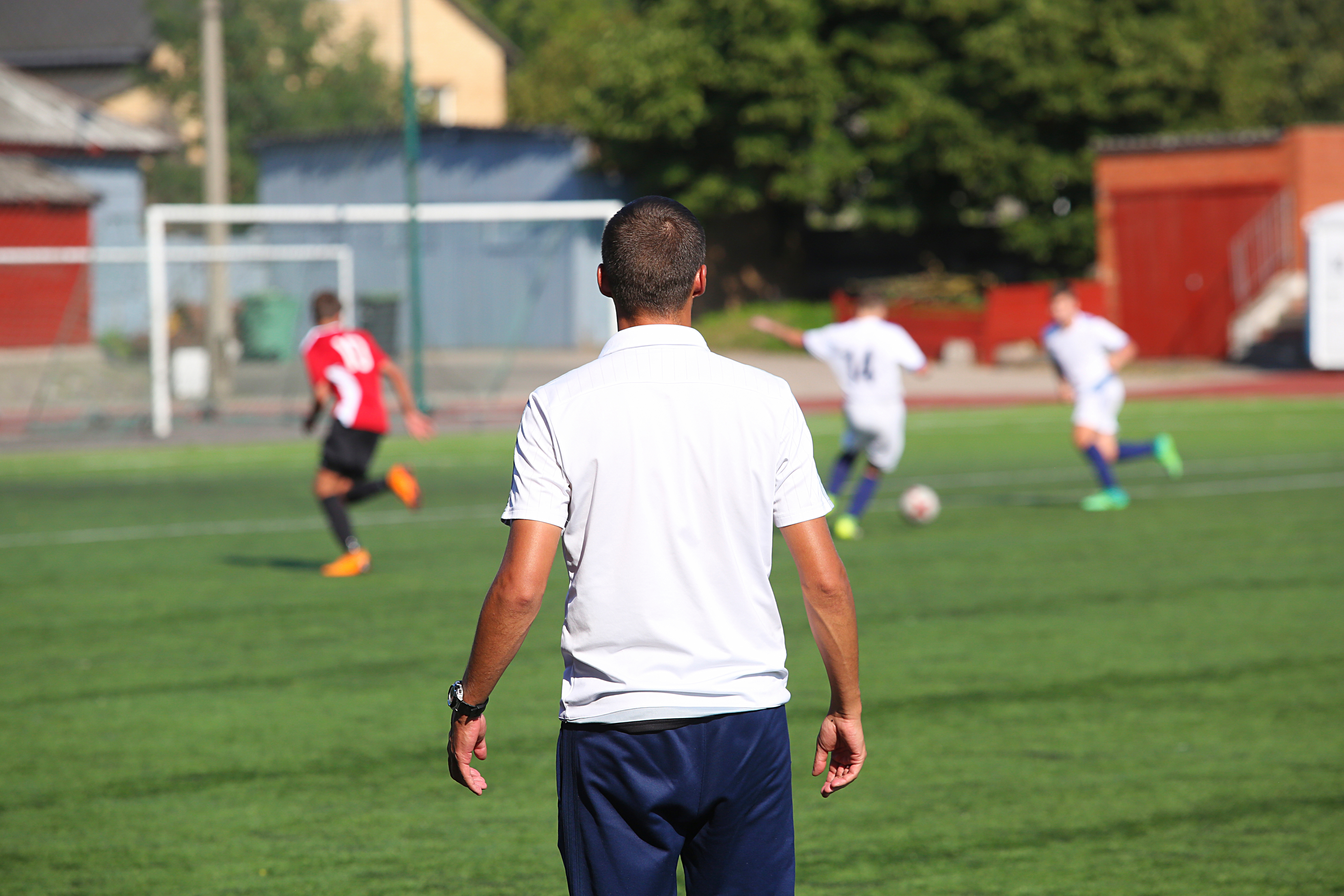 Volunteer guiding kids in sports