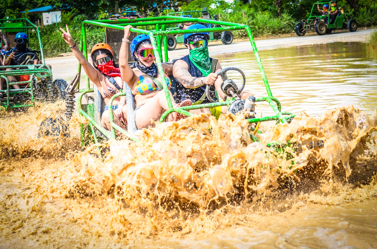 Buggy splashing through water on off-road Punta Cana trail