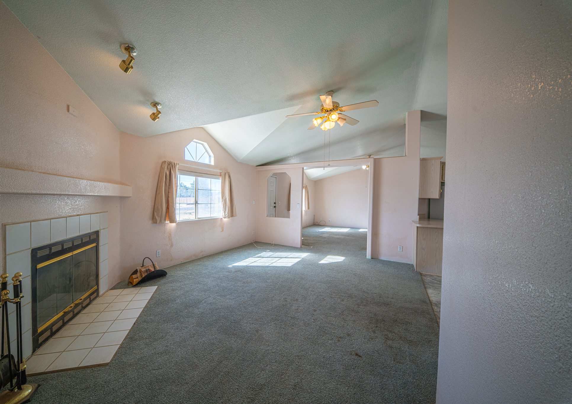 Original living room with dated finishes